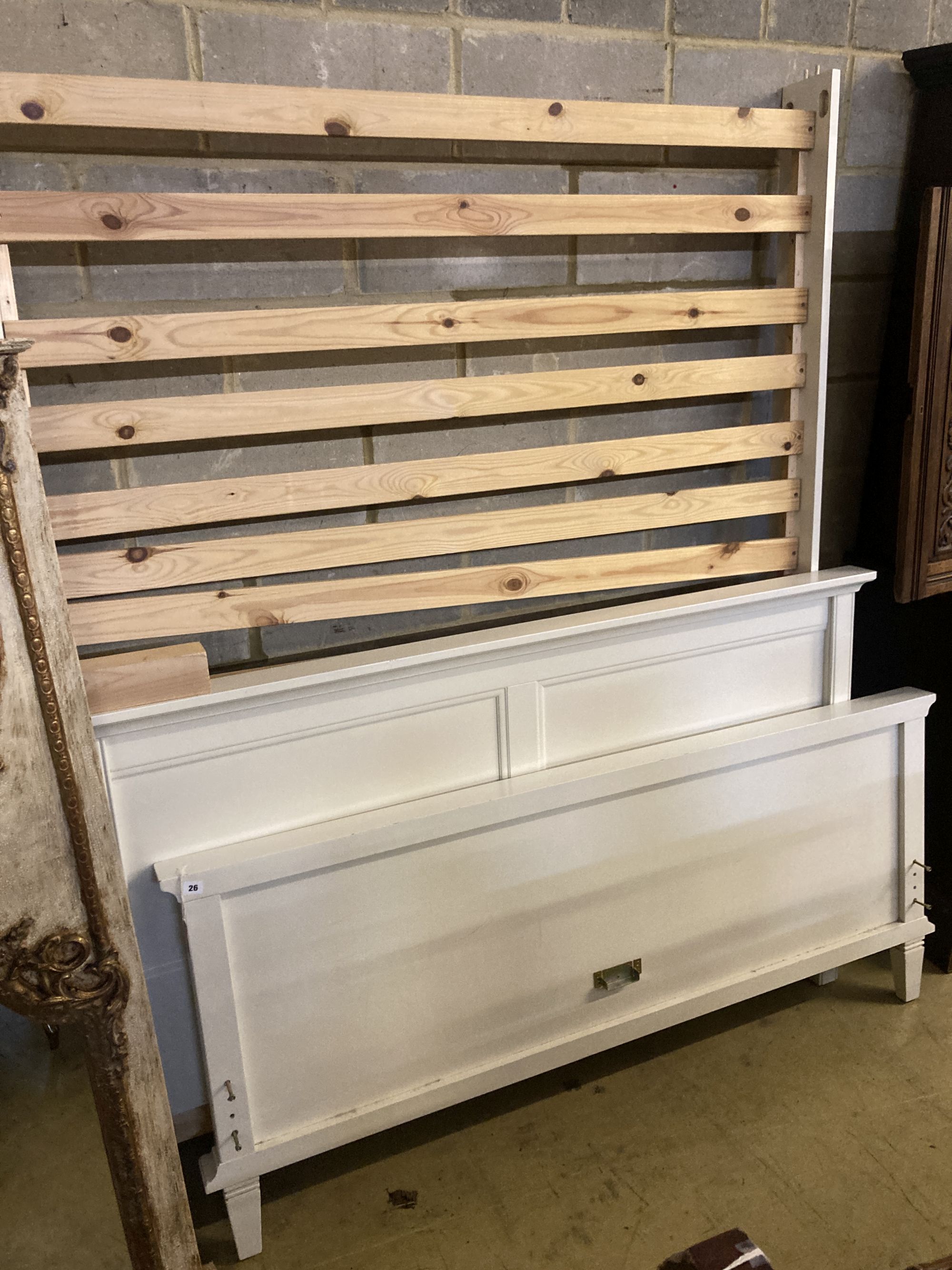 A contemporary white painted five foot bedframe, headboard height 102cm